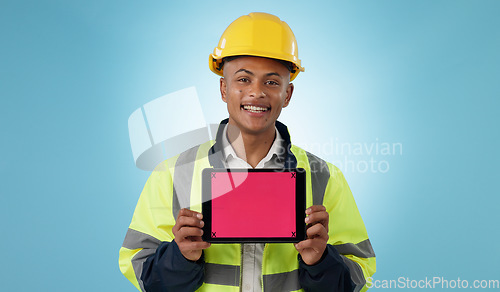 Image of Engineering man, tablet screen and mockup for industrial presentation of renovation, architecture or design in studio. Portrait of construction worker with digital tracking markers on blue background