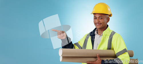Image of Man, construction worker and pointing with building plans, safety wear and architect on studio background. Professional, mockup space and industrial blueprint for engineering project, builder and job