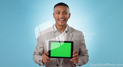 Image of Business man, tablet green screen and advertising for website space, information or trading software in studio. Portrait of trader with digital mockup, space and tracking markers on a blue background