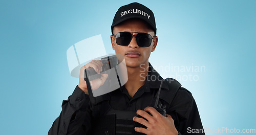 Image of Portrait, security guard and serious man in sunglasses, safety protection service or law enforcement. Face, cop and police officer for justice, danger or crime in studio isolated on a blue background