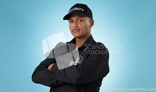 Image of Security guard, portrait and man in studio with arms crossed, walkie talkie and surveillance of law enforcement or on blue background. Serious bodyguard with safety radio for crime, patrol and danger
