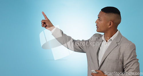 Image of Weather forecast, pointing or man talking with hands for mockup space on blue background. Reporter, anchor or presenter in broadcast for presentation, climate change prediction or news in studio