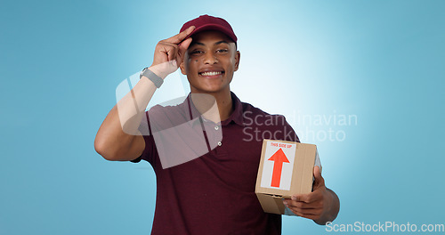 Image of Happy man, shipping box or portrait of delivery guy in studio with courier service or supply chain package. Smile, blue background or worker greeting distribution, online shopping or post services