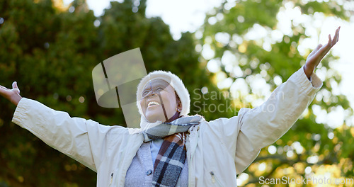 Image of Nature, freedom and happy senior woman in a park for happy, celebration or travel adventure. Retirement, energy and African female person in a forest with gratitude for life, peace and fresh air