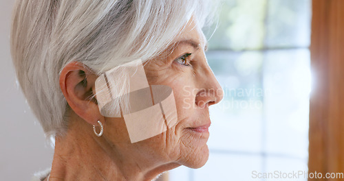 Image of Senior, woman and face with thinking by window of memory, alzheimer and idea in retirement home with smile. Elderly, person and thoughtful with nostalgia, remember and relax in assisted living