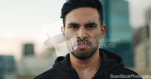 Image of Workout sweat, city portrait and man serious, determined and ready for outdoor cardio, fitness or sports performance. Face, active and angry athlete, runner or person for exercise training routine