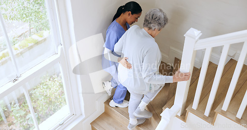 Image of Nurse, senior woman and support on stairs, help and walk in nursing home. Caregiver, assistance on steps and elderly patient with a disability, injury or sick in rehabilitation for medical healthcare