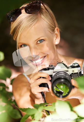 Image of Portrait, photographer and nature with woman in forest for trees, environment and relax. Shooting, camera lens and photography with face of female person in woods for travel, torusim and summer