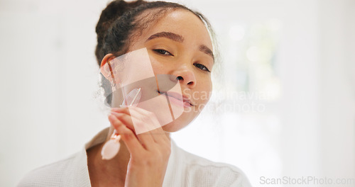 Image of Face, skincare and woman with derma roller in bathroom for wellness, collagen or circulation at home. Portrait, smile or lady with crystal facelift, lymphatic drainage or facial, anti aging massage