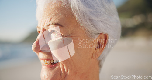 Image of Senior woman, smile and sunset at a beach with peace outdoor in nature, sea and elderly female person with mindfulness. Relax, happy and calm old lady thinking by the ocean on holiday in retirement