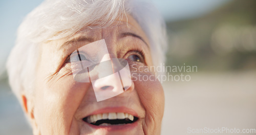 Image of Sunset, smile and senior woman at a beach with peace outdoor in nature, sea and elderly female person with mindfulness. Relax, happy and calm old lady thinking by the ocean on holiday in retirement