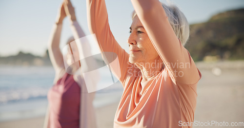 Image of Yoga, meditation and senior women, stretching and fitness on beach for wellness, exercise and pilates training. Zen, friends and old people for muscle health, mindfulness and relax in nature and sea