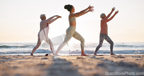 Image of Beach yoga class, sunset and meditation coach teaching breathing, mindfulness and spiritual chakra, aura or soul healing. Ocean waves, relax yogi and personal trainer coaching learning pilates group