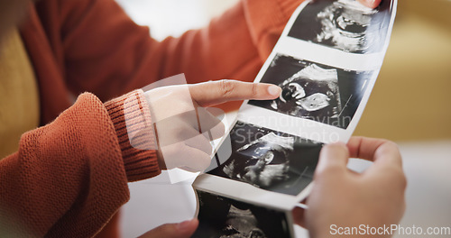 Image of Ultrasound, surprise and ivf pregnancy with a gay couple in the living room of their home together for celebration. Wow, LGBT or lesbian with a woman and partner hugging while looking at a picture