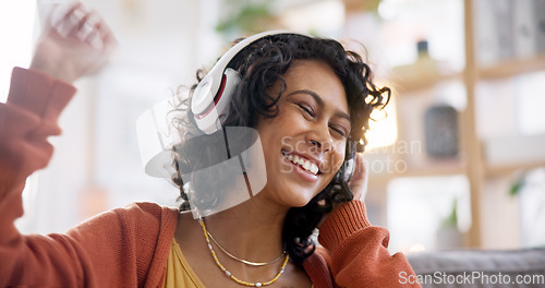 Image of Home, smile and woman with headphones, music and dance with audio, streaming sounds and songs. Person on a couch, girl and lady with headset, energy and radio with freedom, motivation and happiness