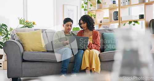 Image of Lounge sofa, face and gay people speaking, talking and chat about omnichannel. LGBT, laptop and lesbian couple conversation on home online shopping choice, social media post or reading info.