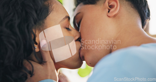 Image of Lesbian couple, kiss and love of women in home, romance and bonding together. Gay girls, intimate and lgbtq care in commitment, connection and healthy relationship in homosexual marriage at house