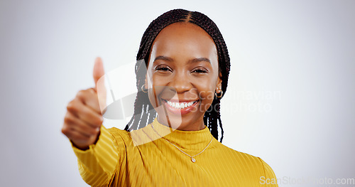 Image of Thumbs up, woman and portrait in studio for success, winning deal and happy achievement on white background. African model, emoji and like sign for feedback, voting yes and thank you for excellence