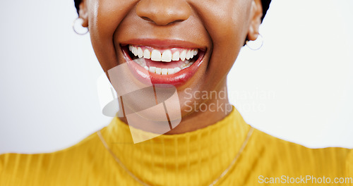 Image of Teeth whitening, smile and closeup of black woman and mouth, lips or happiness in studio white background. Dental, healthcare or happy with veneers from orthodontics and half of face at dentist