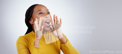 Image of News, announcement and happy black woman shouting in studio for coming soon, deal or info on grey background. Screaming, excited and female model with emoji for giveaway, sale or sign up motivation