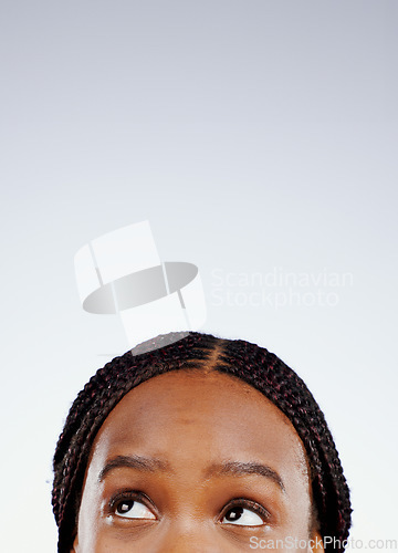 Image of Thinking, face and eyes of black woman with question, solution or remember ideas in white background. Mockup, space and person with a memory, choice or creative planning and problem solving in studio