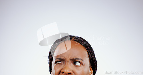 Image of Confused, face and eyes of black woman thinking with doubt, questions or remember idea in white background. Mockup, space and person frustrated with a memory, choice or planning a decision in studio