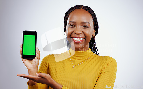 Image of Woman, phone and green screen of marketing mockup, presentation and happy news on a white background. Face of african person on mobile app, design space and opportunity with tracking marker in studio