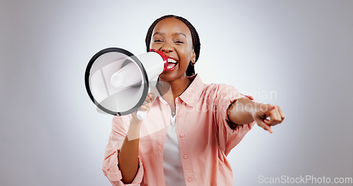 Image of Woman, megaphone and winner choice in announcement, broadcast or join us for opportunity on a white background. Portrait of African person pointing you for competition, bonus and winning in studio