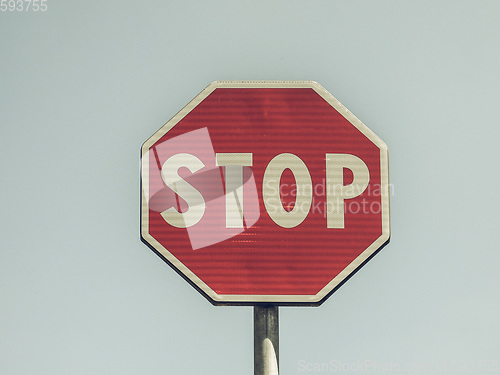 Image of Vintage looking Stop sign over blue sky