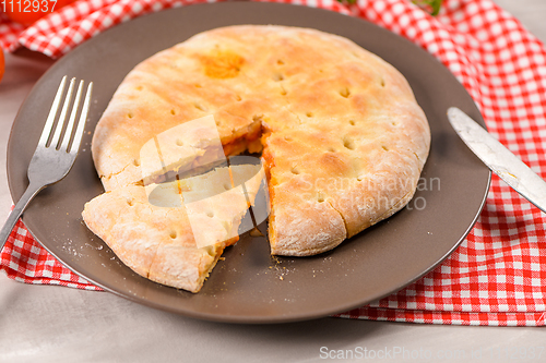 Image of Pizza calzone on wooden background
