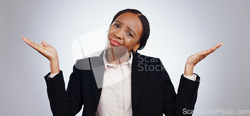 Image of Confused, portrait and black woman in studio with why, hands or shrug sign on grey background. Business, questions or face of lady entrepreneur with palm scale emoji for doubt, balance or dont know