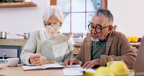 Image of Senior couple, budget and finance notebook with writing and life insurance information for will at table. Discussion, list and paper for process and bills review in print in a retirement home