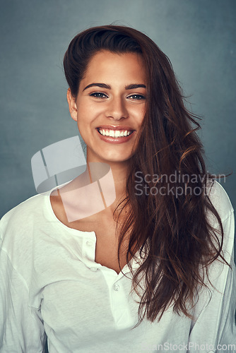 Image of Woman, smile and portrait or happy, fashion and pose by studio background, casual and face. Female person, beauty and cosmetics, confident and trendy in aesthetic, cool and stylish clothing or joy