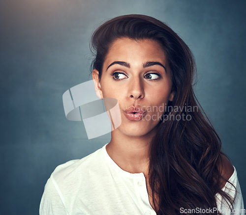 Image of Woman, funny face and fashion in studio, pose and mockup by background, stylish and cool clothing. Female person, pout and beauty or cosmetics, emoji and trendy in aesthetic, goofy and silly by space