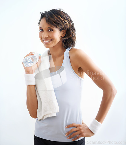 Image of Fitness portrait, water or woman happiness after exercise, pilates workout or drinking beverage, H2O or cold liquid. Thirst, yoga studio or sports athlete smile for hydration on white background wall