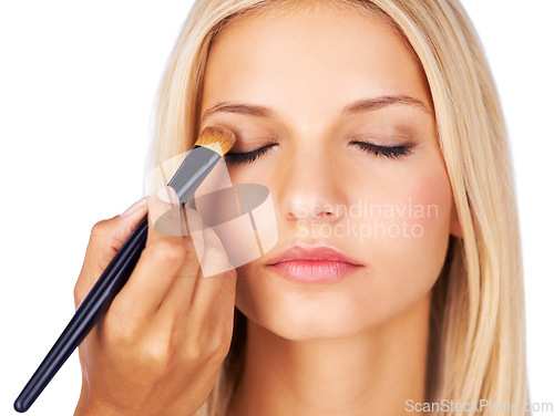 Image of Eyeshadow, makeup brush and woman in studio with hands for beauty, wellness or glamour makeover on white background. Powder, cosmetics lady model face with beautician for professional eye application