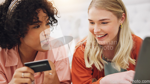 Image of Credit card, laptop and women friends on a bed for sign up, information or ecommerce sale in their home. Online shopping, loan and lady customer in a bedroom with budget app, password or payment deal