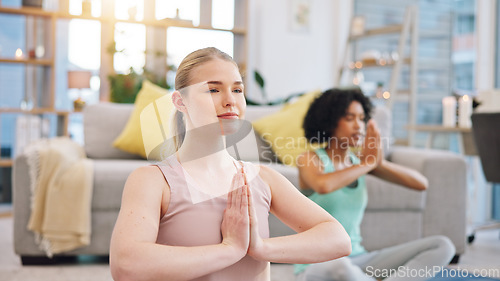 Image of Yoga, meditation and women in home together, fitness and mindfulness training in living room. Balance, breathing and workout, friends in holistic exercise in peace and zen for health in apartment.