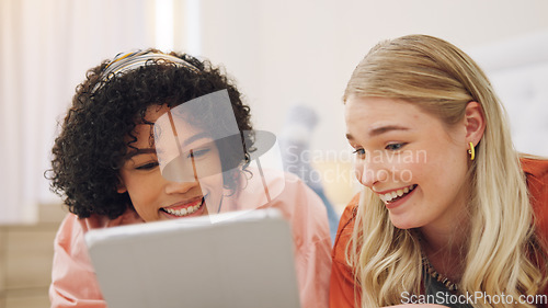 Image of Women, tablet and friends on a bed with social media, streaming and discussion at home. Online, movies and ladies relax in a bedroom with conversation, internet and subscription service survey