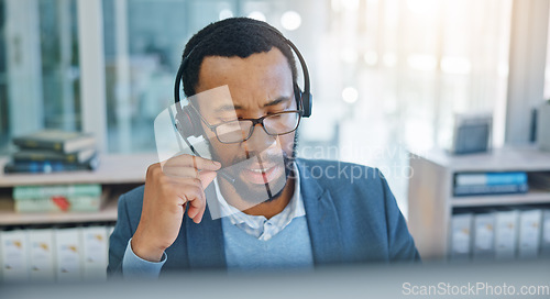 Image of Computer, call center and support with a black man consultant working in customer service for assistance. Contact, crm and headset communication with an employee consulting in an office for sales