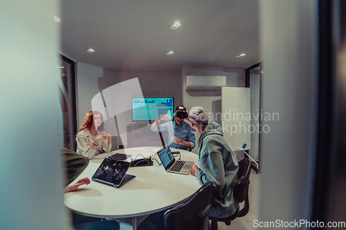 Image of A diverse group of businessmen collaborates and tests a new virtual reality technology, wearing virtual glasses, showcasing innovation and creativity in their futuristic workspace