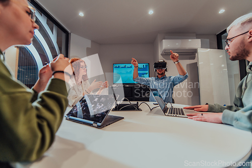 Image of A diverse group of businessmen collaborates and tests a new virtual reality technology, wearing virtual glasses, showcasing innovation and creativity in their futuristic workspace