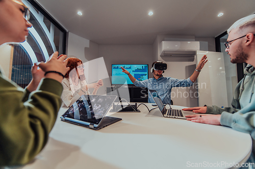 Image of A diverse group of businessmen collaborates and tests a new virtual reality technology, wearing virtual glasses, showcasing innovation and creativity in their futuristic workspace