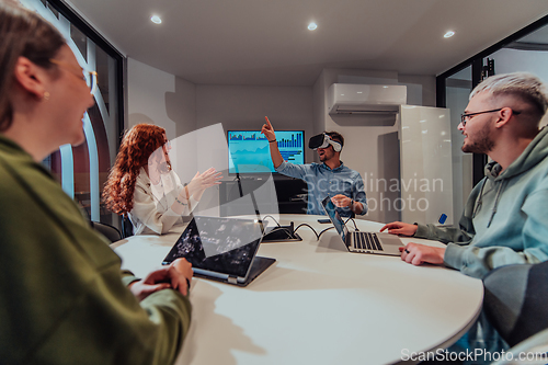 Image of A diverse group of businessmen collaborates and tests a new virtual reality technology, wearing virtual glasses, showcasing innovation and creativity in their futuristic workspace