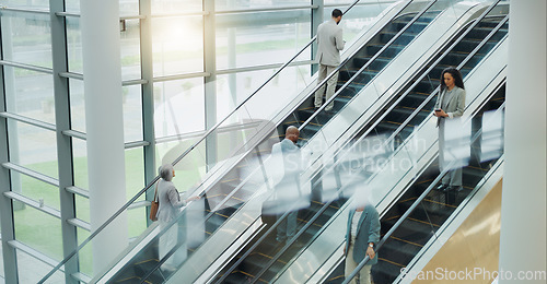 Image of Business people, elevator and travel with office and international trip with lens flare. Corporate, professional on escalator and appointment with conference, stairs for convention and executives