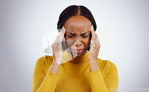 Image of Stress, pain and black woman with a headache, frustrated and tension on a white studio background. African person, girl and model with a migraine, depression and strain with mind fatigue or emergency