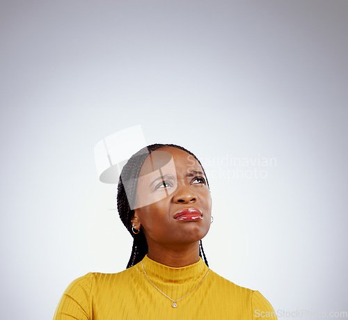 Image of Woman, thinking and doubt for confused, decision and problem solving with idea by grey background. Student, african and trendy youth in brainstorming or university choice, education and studio mockup