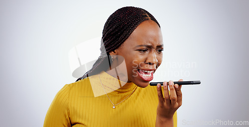 Image of Phone, black woman and angry from scam conversation and anxiety from problem and fail. Studio, white background and frustrated female person with spam communication and identity theft mistake