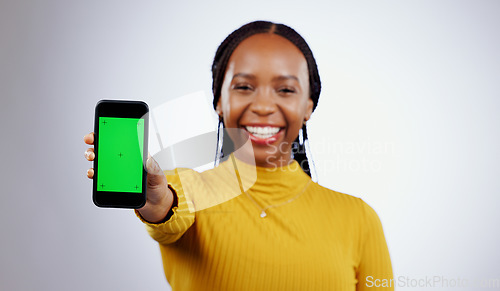 Image of Woman, student and phone green screen for marketing mockup, e learning sign up or news on white background. Portrait of african person on mobile app space, college contact or education FAQ in studio