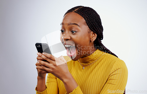 Image of Woman, reading phone and wow for happy news, social media competition or giveaway success on a white background. African person with surprise, excited and shocked for mobile sale or bonus in studio